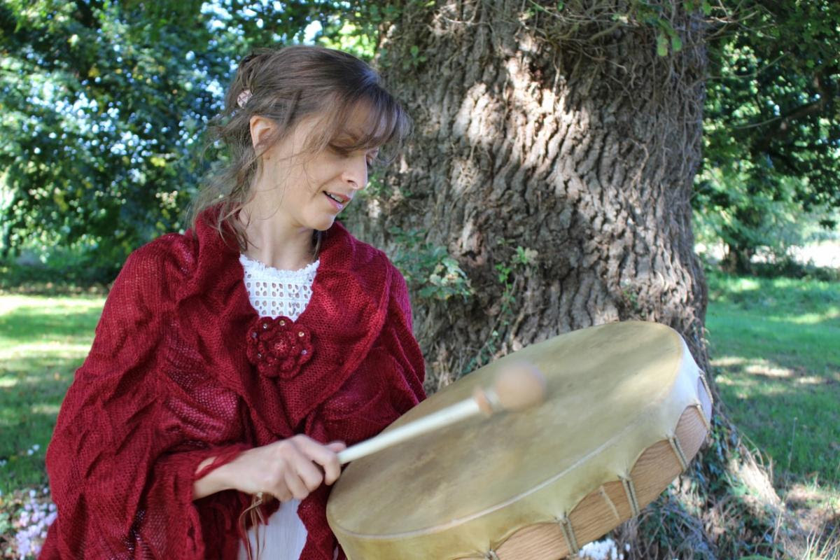 woman drumming outdoors